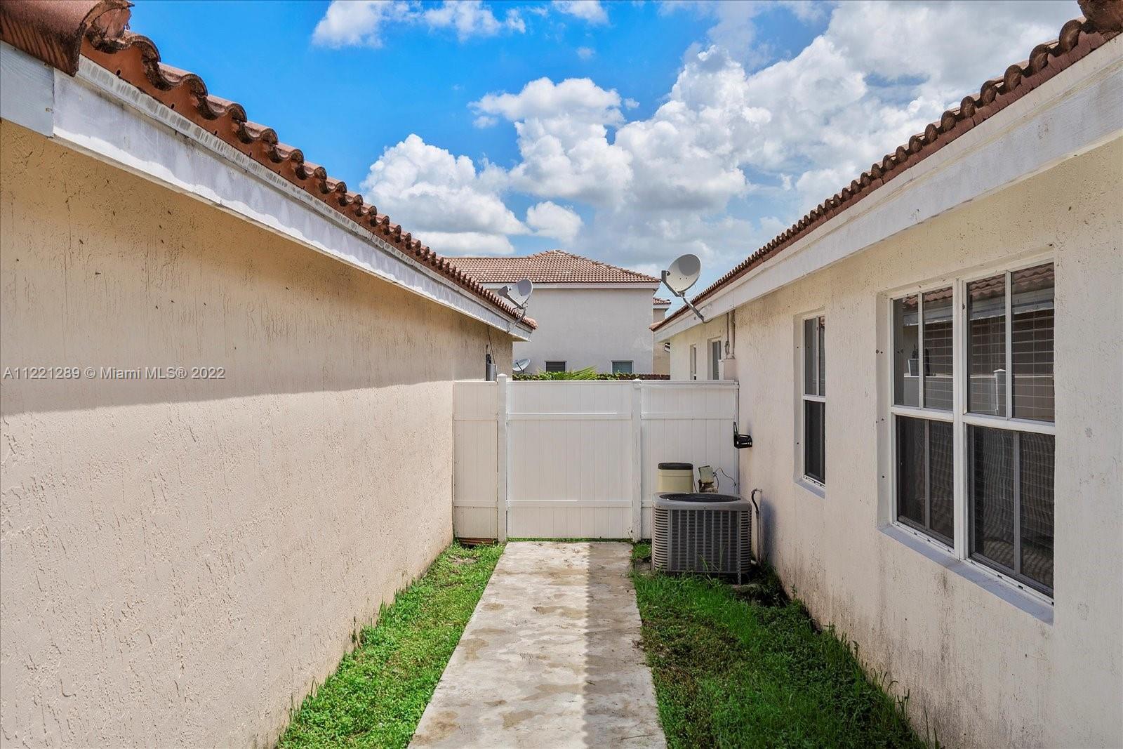 7384 Granada Way Margate, FL 33063 - Photo 27 of 30 a view of a back yard of the house