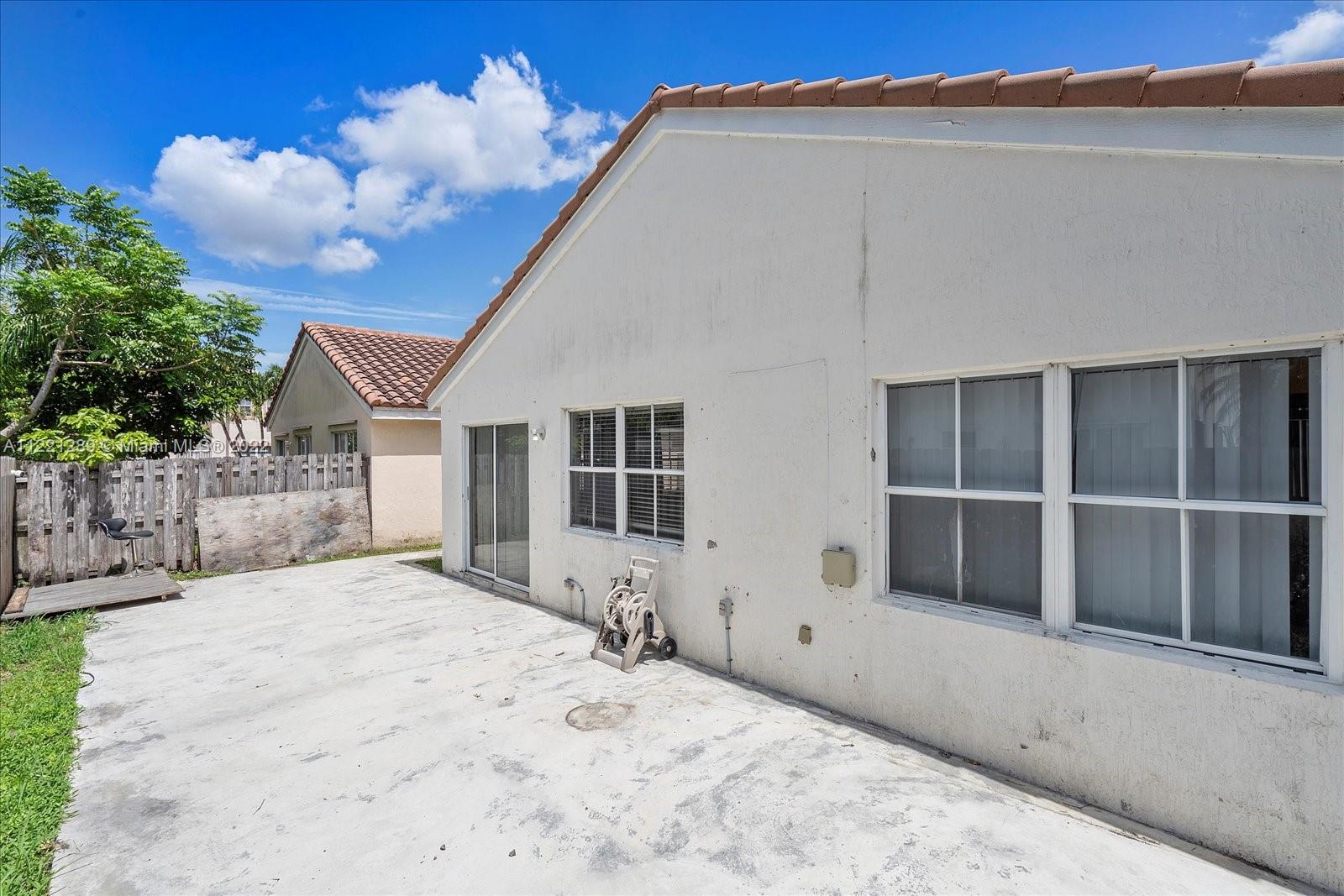 7384 Granada Way Margate, FL 33063 - Photo 28 of 30 a front view of a house with a yard and garage