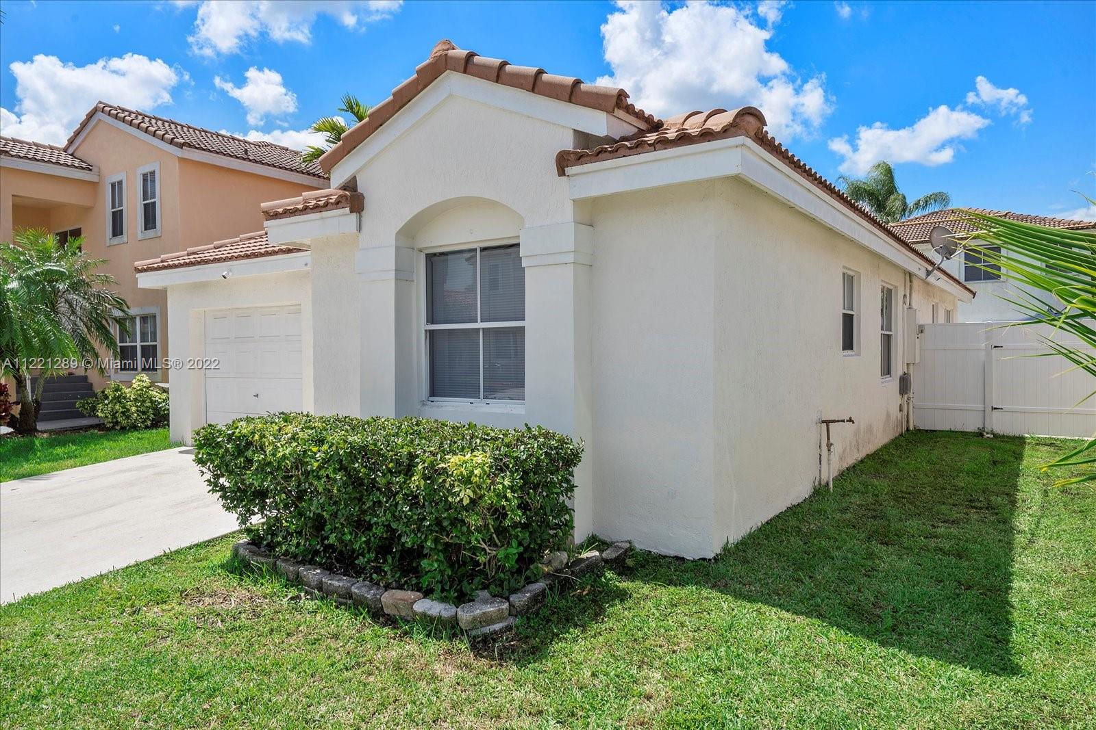 7384 Granada Way Margate, FL 33063 - Photo 3 of 30 a view of a house with a yard