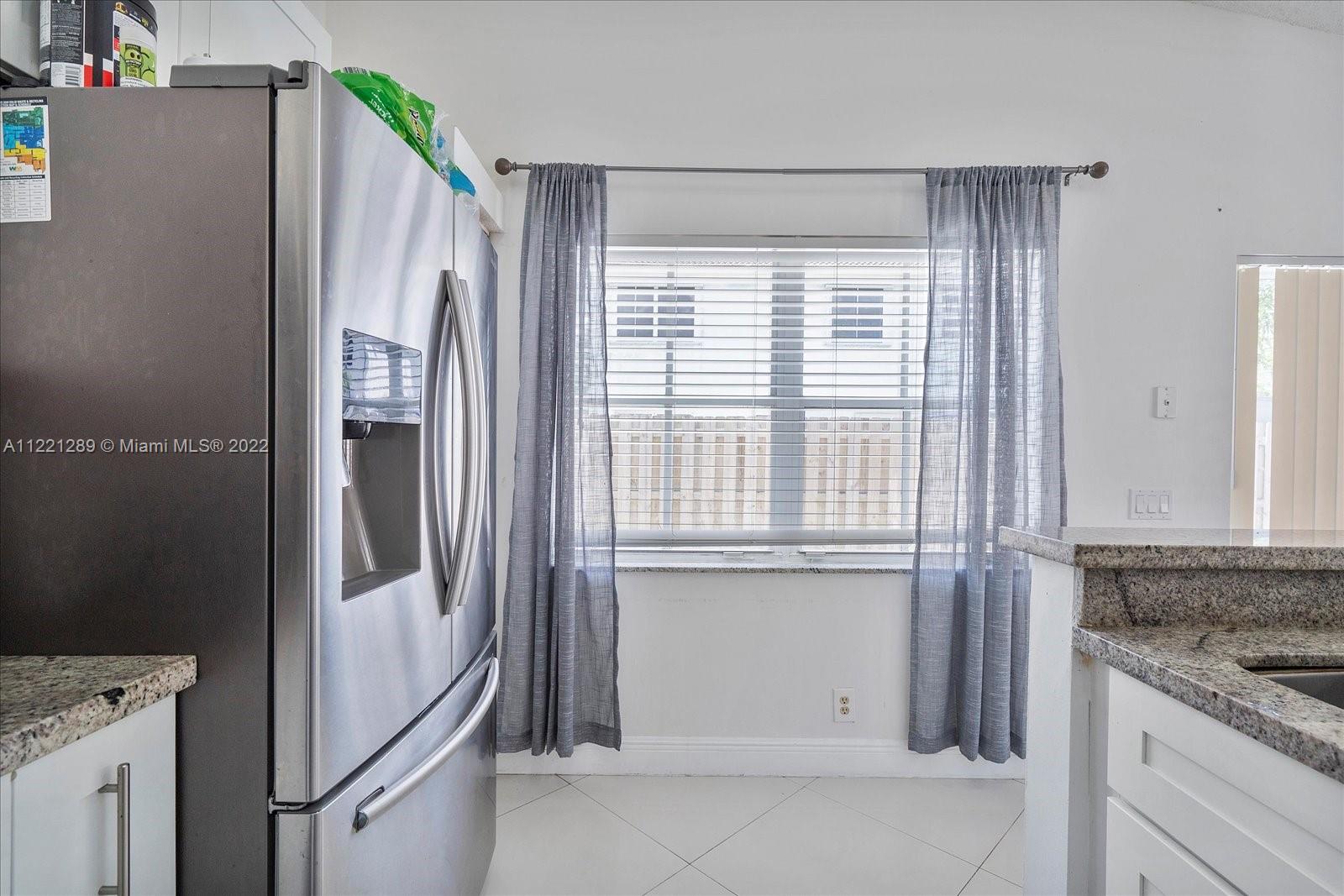 7384 Granada Way Margate, FL 33063 - Photo 7 of 30 a kitchen with stainless steel appliances granite countertop a refrigerator and a sink