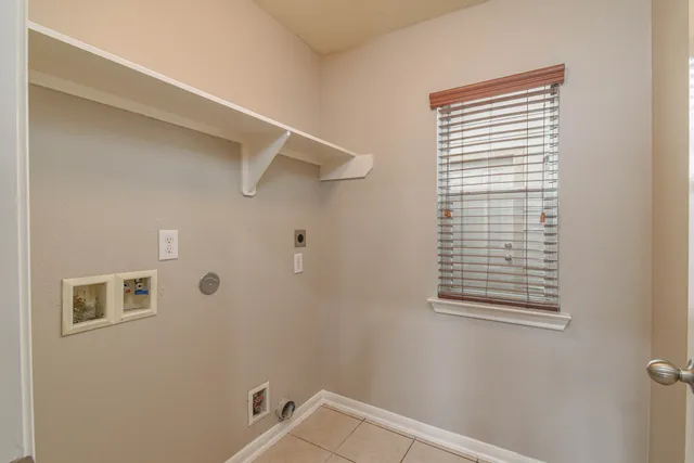 a bathroom with a window and shower