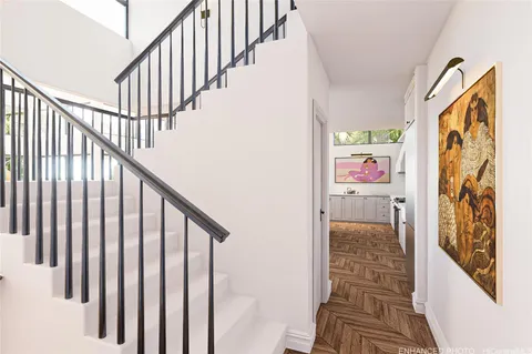 a view of entryway with wooden floor and stairs
