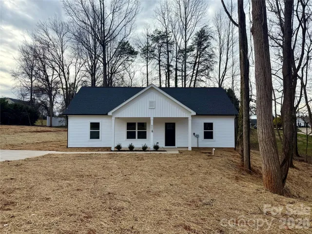 a house with trees in the background