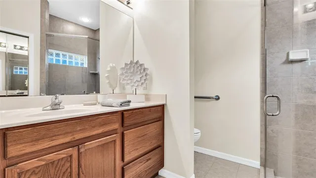 a bathroom with a shower and a sink