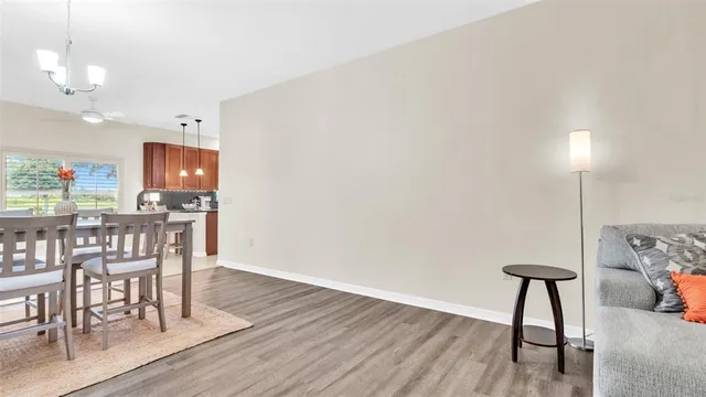 a kitchen with a table and chairs in it