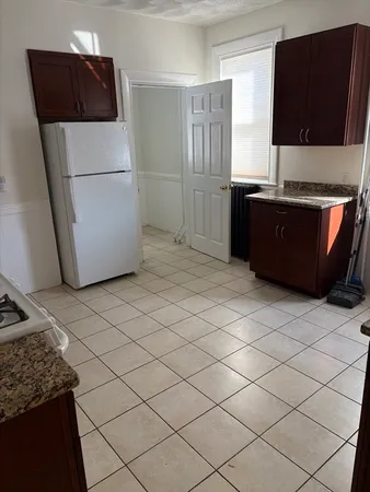 a kitchen with stainless steel appliances a refrigerator sink and microwave