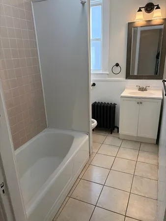 a bathroom with a bathtub sink and toilet
