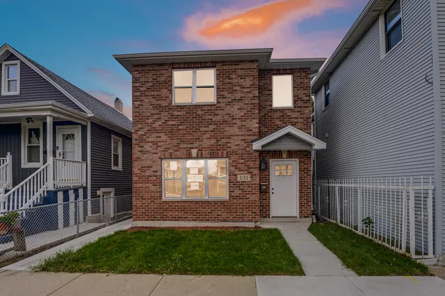a front view of a house with a yard