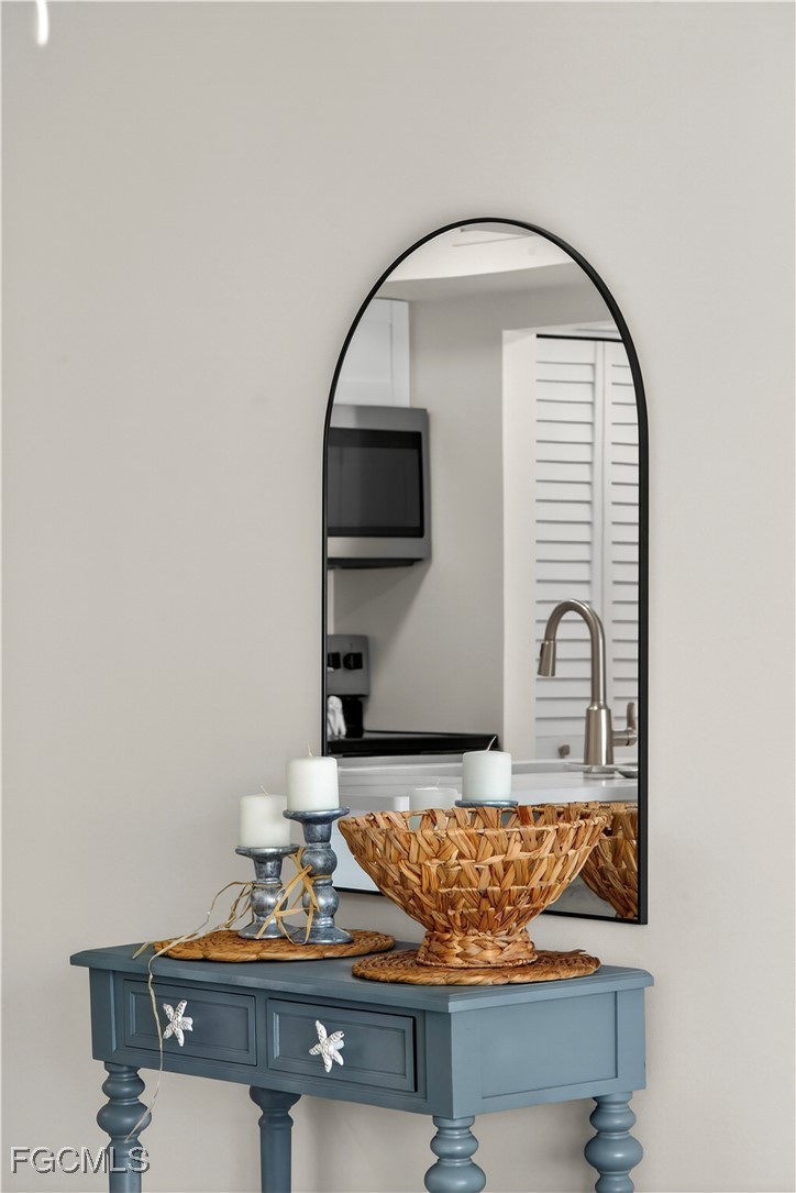 200 Lenell Road, Unit 214 Fort Myers Beach, FL 33931 - Photo 24 of 32 a room with painting on the wall and a potted plant