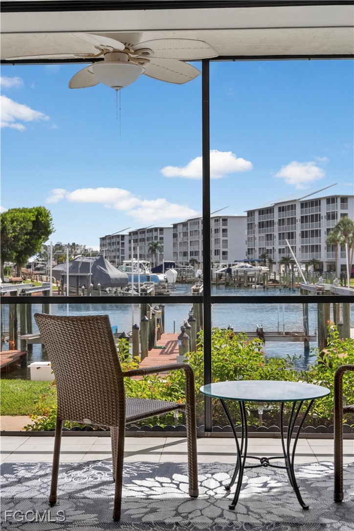 200 Lenell Road, Unit 214 Fort Myers Beach, FL 33931 - Photo 25 of 32 a view of a chairs and table in patio