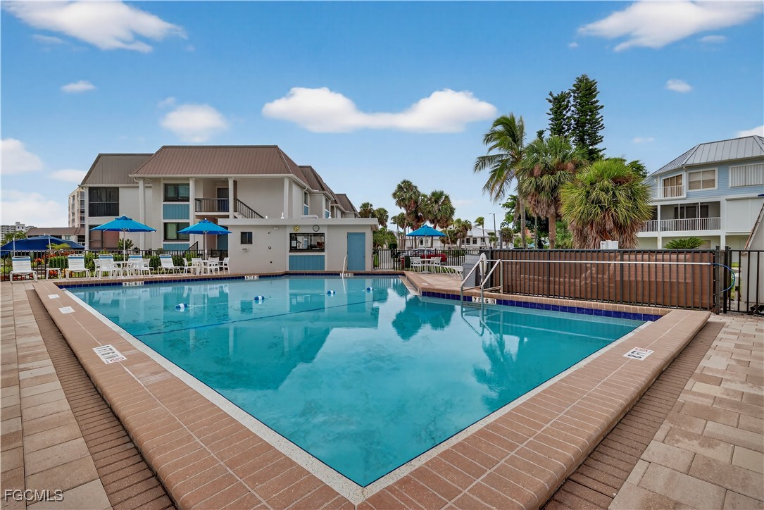 200 Lenell Road, Unit 214 Fort Myers Beach, FL 33931 - Photo 29 of 32 a view of swimming pool with outdoor seating