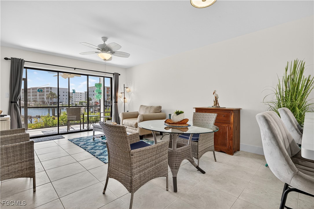 200 Lenell Road, Unit 214 Fort Myers Beach, FL 33931 - Photo 9 of 32 a living room with furniture and a large window