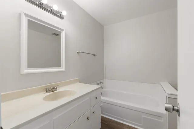 a bathroom with a sink and a bathtub