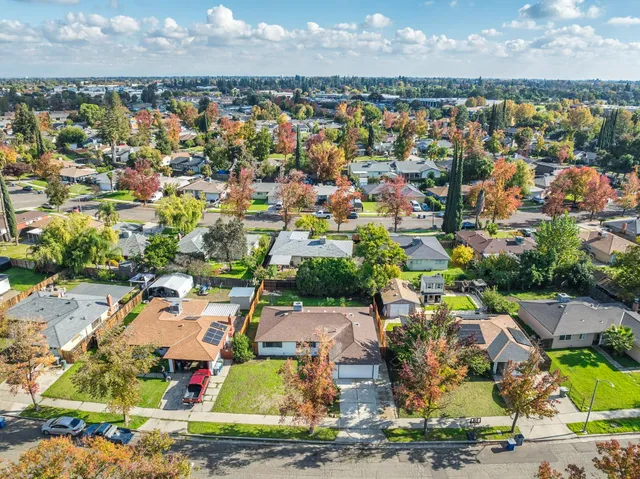 an aerial view of residential houses with outdoor space