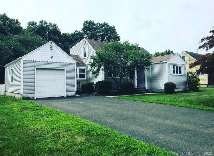 17 Bonheur Road Trumbull, CT 06611 - Photo 1 of 1 a front view of a house with a yard and garage