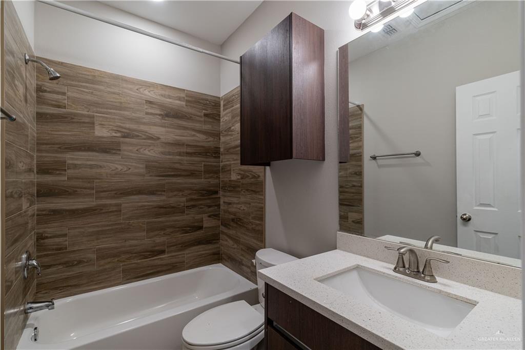 1005 West Kohala Avenue, Unit 4 Alton, TX 78573 - Photo 11 of 21 a bathroom with a sink and a mirror