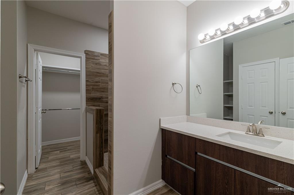 1005 West Kohala Avenue, Unit 4 Alton, TX 78573 - Photo 13 of 21 a bathroom with a sink and a mirror