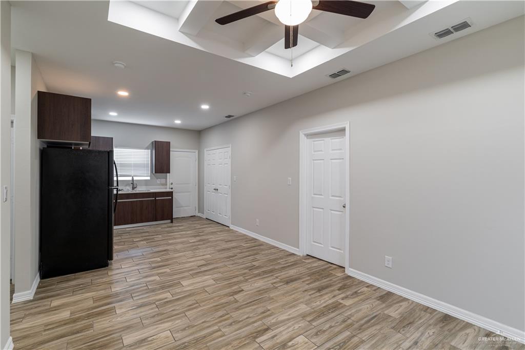 1005 West Kohala Avenue, Unit 4 Alton, TX 78573 - Photo 5 of 21 a view of kitchen with a sink and refrigerator