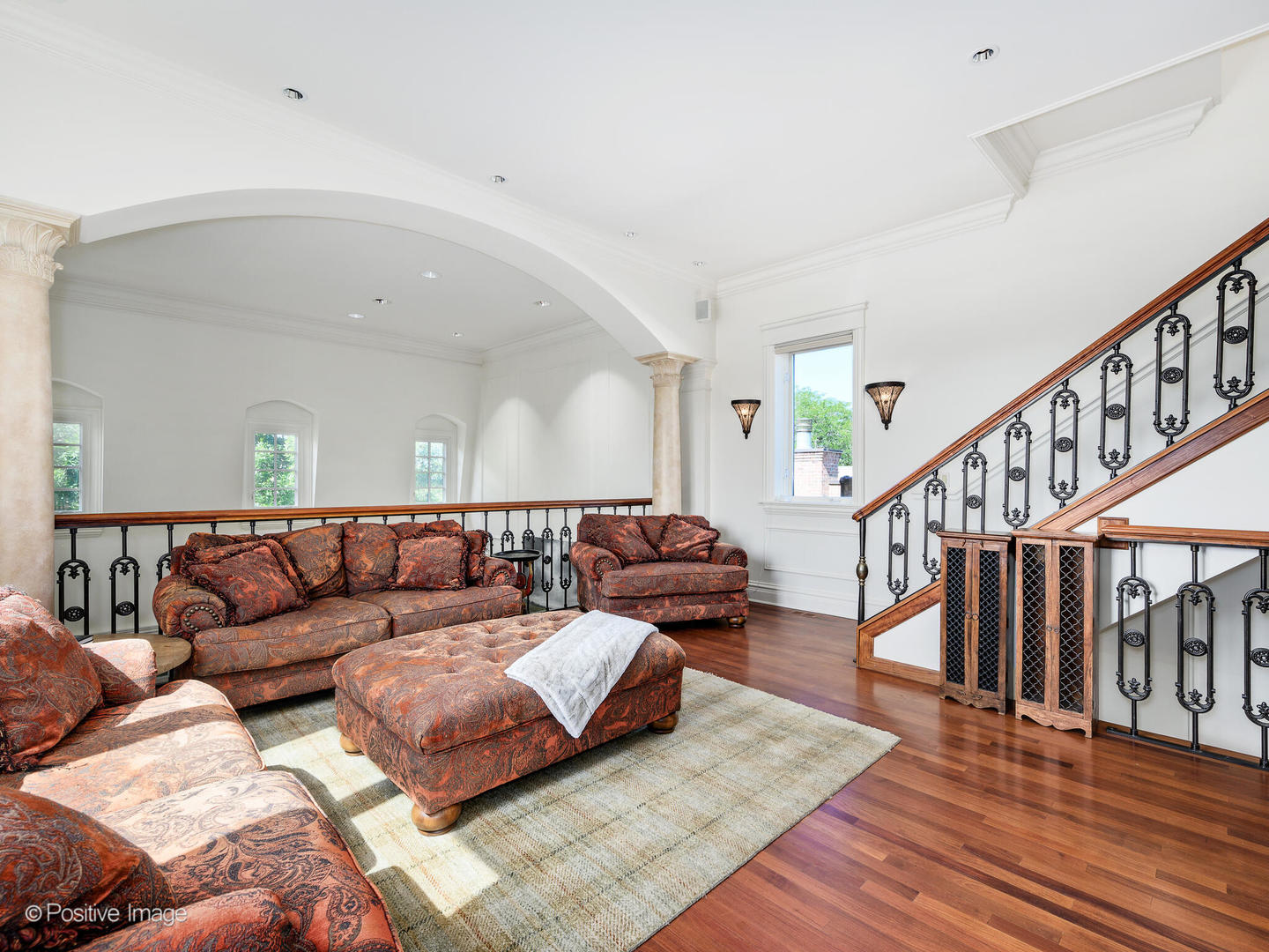 2019 North Mohawk Street, Unit 3 Chicago, IL 60614 - Photo 11 of 27 a living room with furniture and stairs with wooden floor