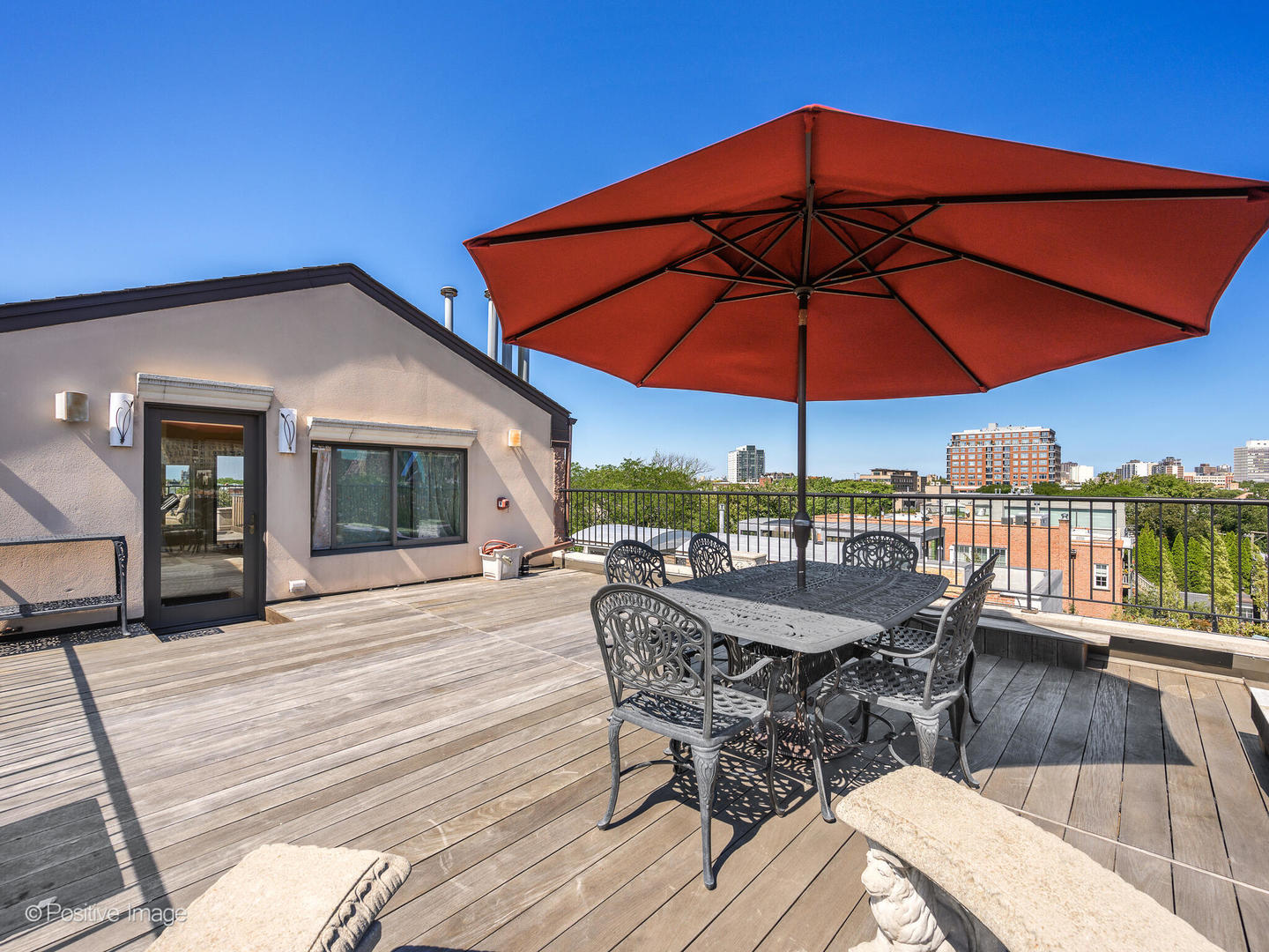 2019 North Mohawk Street, Unit 3 Chicago, IL 60614 - Photo 26 of 27 a dining space with furniture and umbrella