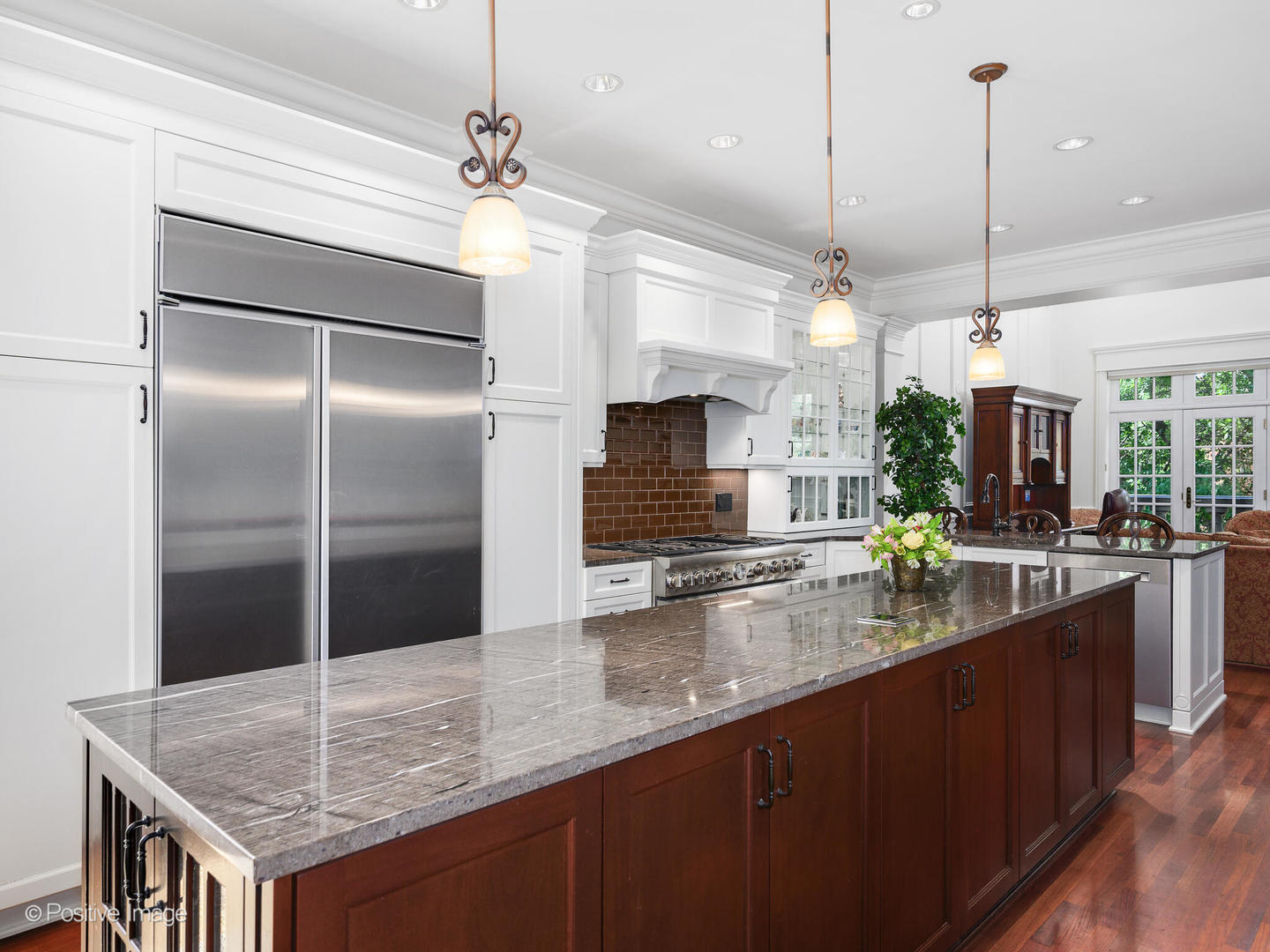 2019 North Mohawk Street, Unit 3 Chicago, IL 60614 - Photo 7 of 27 a kitchen with kitchen island a counter a sink cabinets and refrigerator