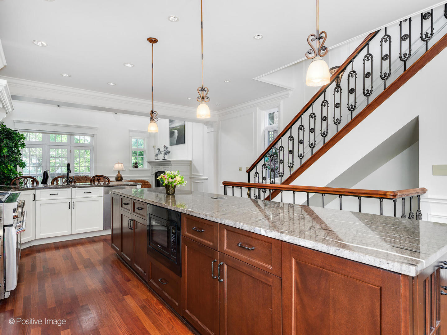 2019 North Mohawk Street, Unit 3 Chicago, IL 60614 - Photo 8 of 27 a kitchen with stainless steel appliances granite countertop a kitchen island a stove a cabinets and wooden floor