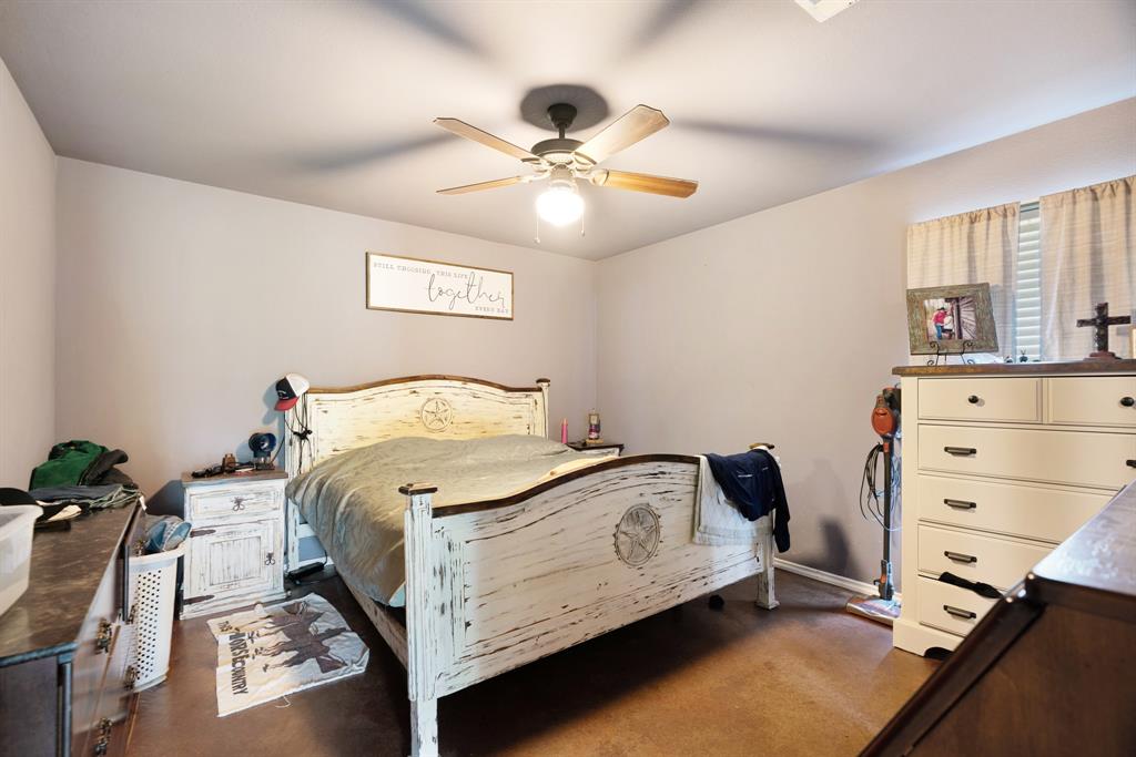 1890 County Road Sumner, TX 75486 - Photo 8 of 20 a bedroom with a bed and window
