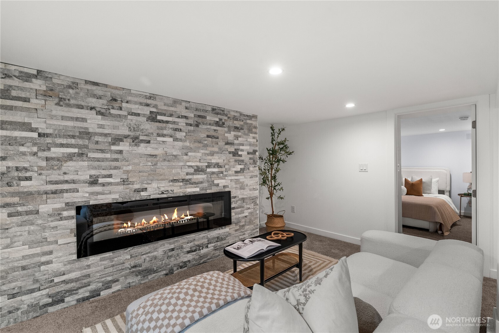 4706 Southwest Eddy Street Seattle, WA 98136 - Photo 12 of 27 a living room with furniture a rug and a fireplace
