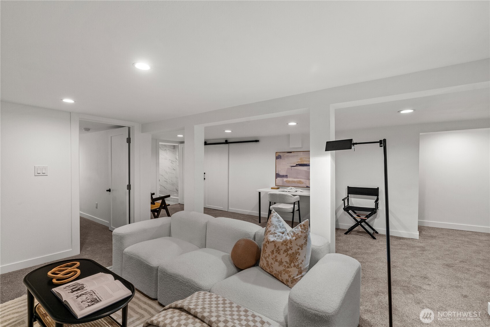 4706 Southwest Eddy Street Seattle, WA 98136 - Photo 17 of 27 a living room with furniture and a wooden floor