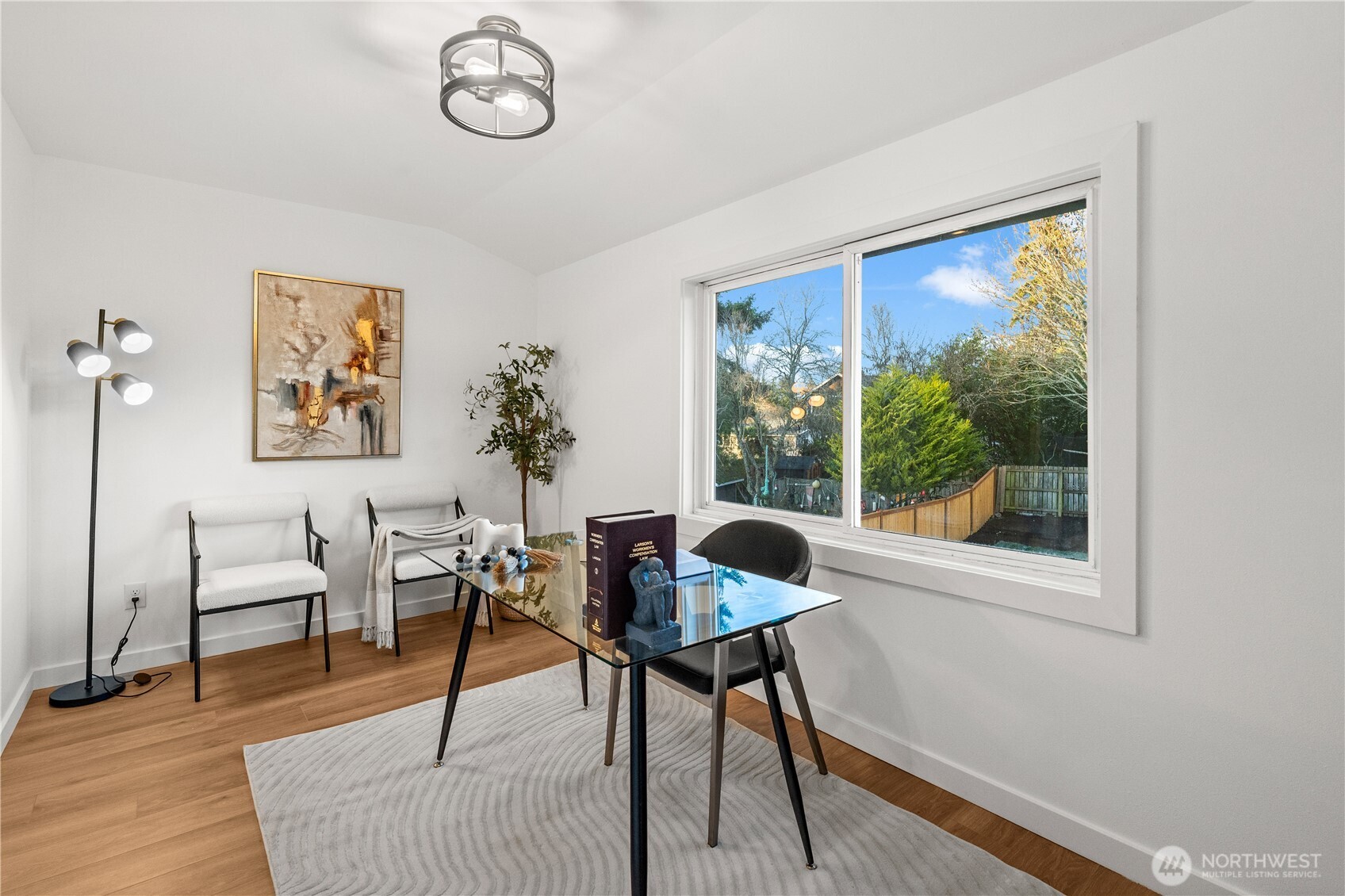 4706 Southwest Eddy Street Seattle, WA 98136 - Photo 19 of 27 a workspace with furniture and a window