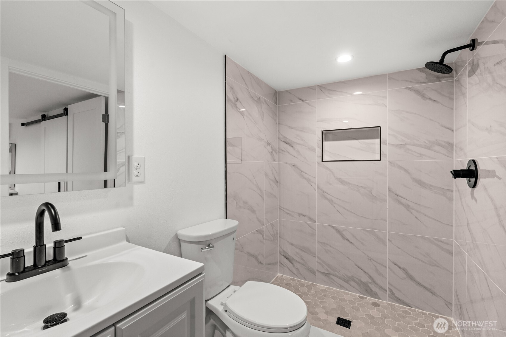 4706 Southwest Eddy Street Seattle, WA 98136 - Photo 21 of 27 a bathroom with a sink a toilet and shower