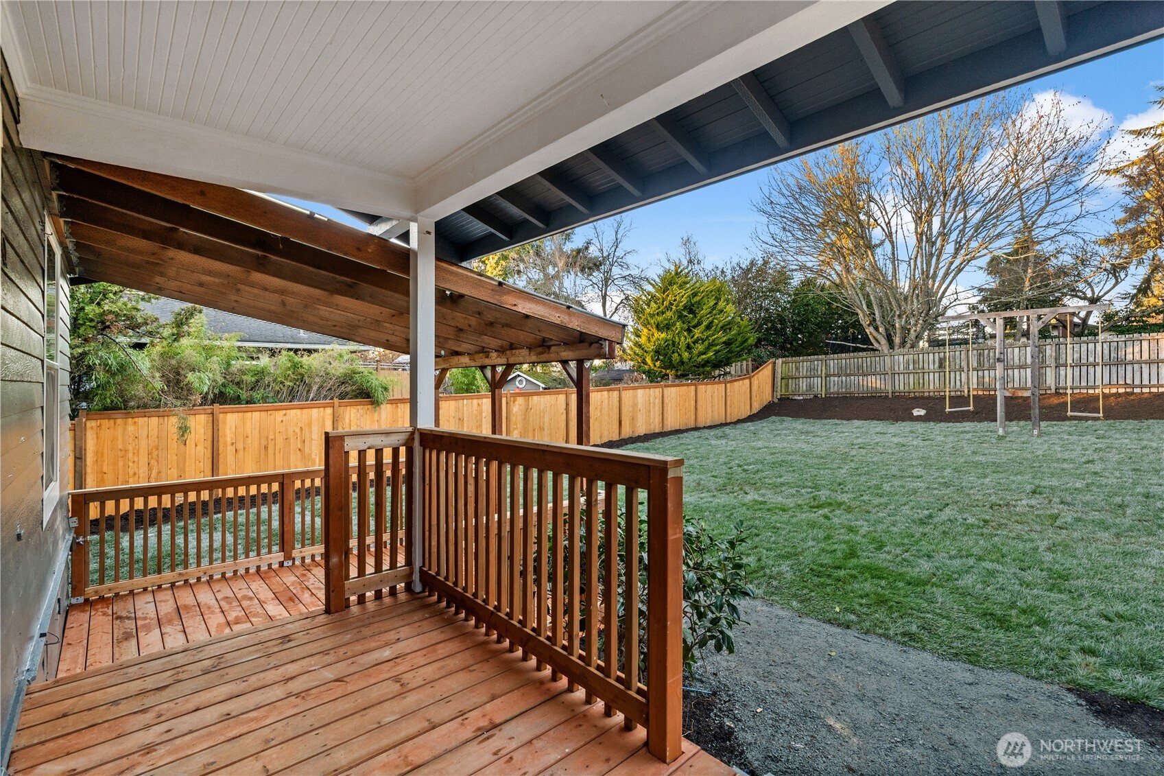 4706 Southwest Eddy Street Seattle, WA 98136 - Photo 25 of 27 a view of a backyard with wooden floor