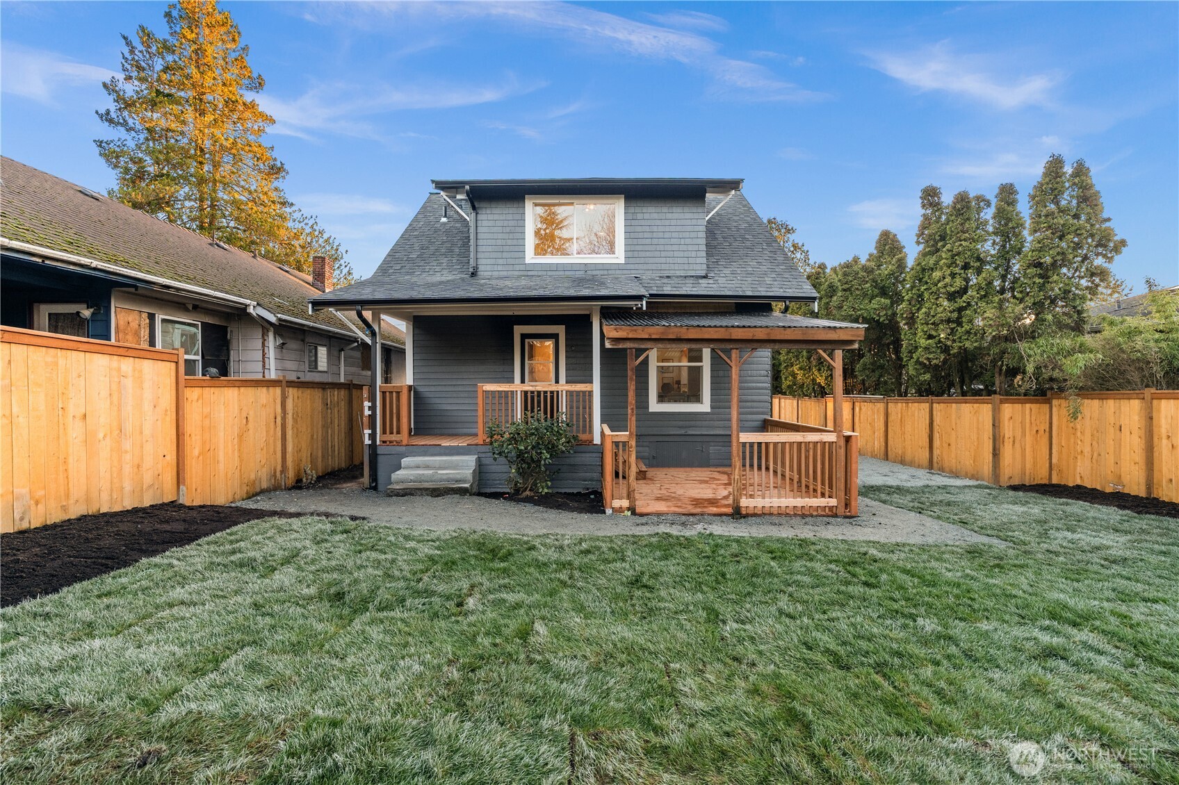 4706 Southwest Eddy Street Seattle, WA 98136 - Photo 26 of 27 a front view of a house with a yard and a porch