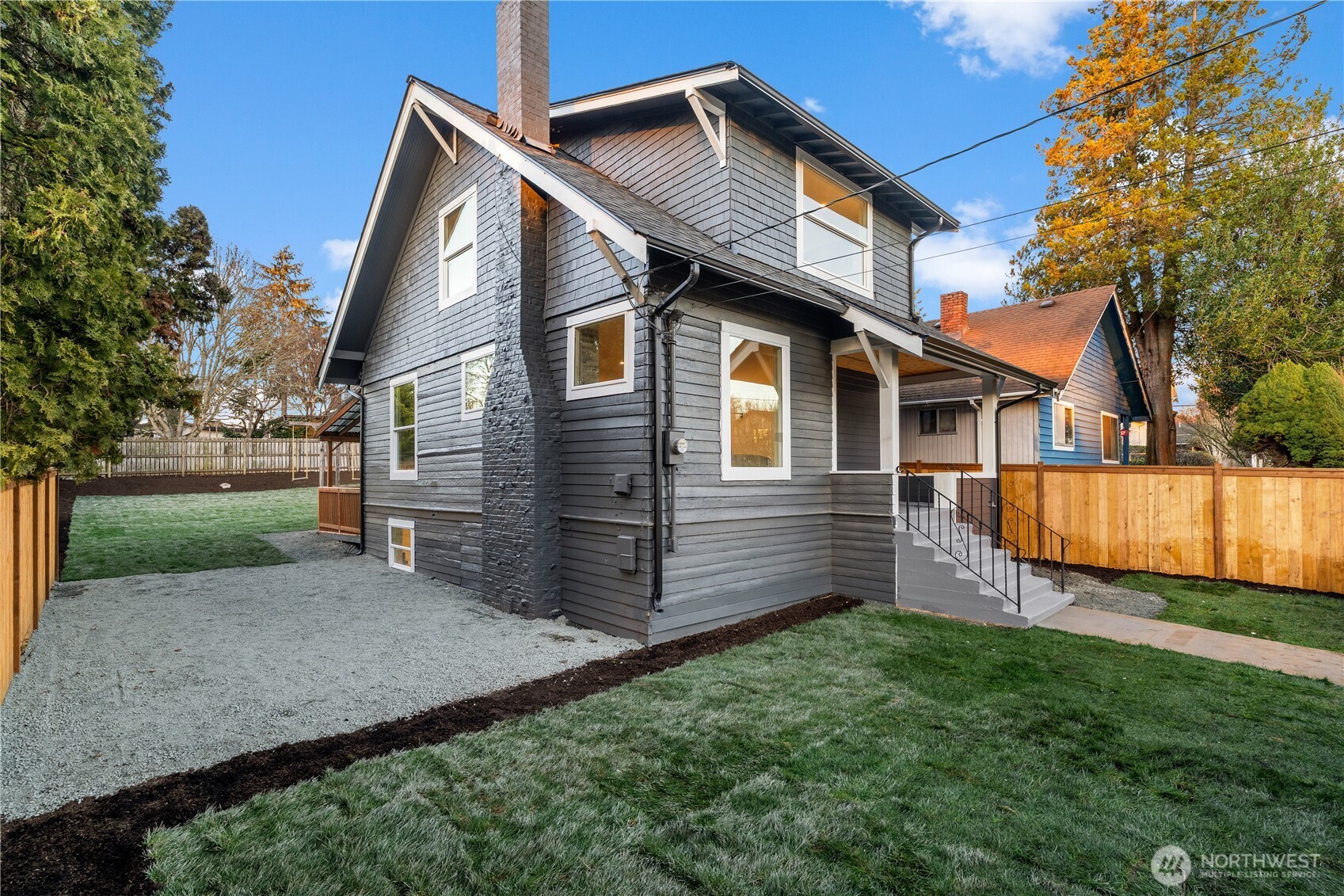 4706 Southwest Eddy Street Seattle, WA 98136 - Photo 3 of 27 a front view of house with yard and green space