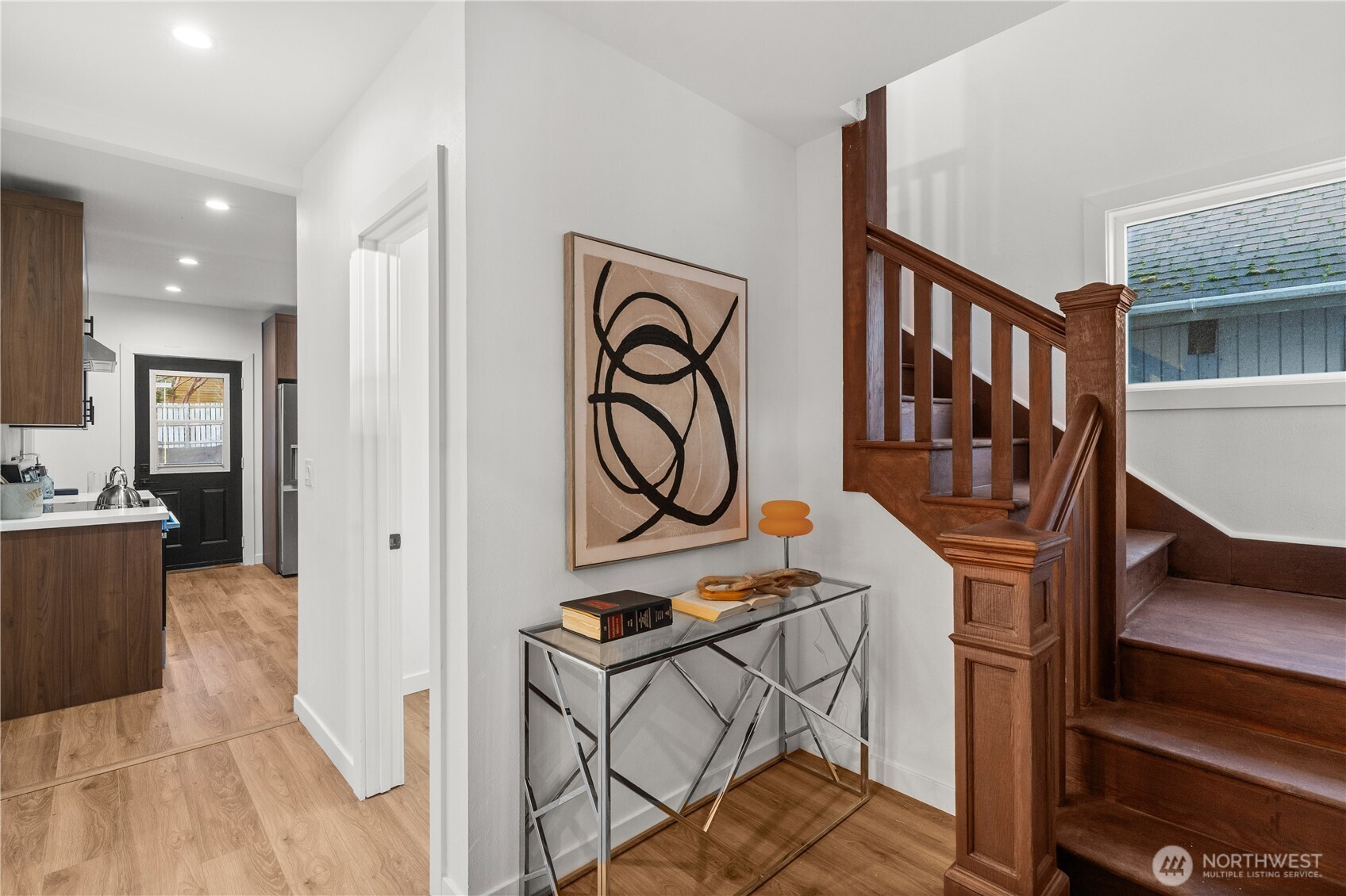 4706 Southwest Eddy Street Seattle, WA 98136 - Photo 4 of 27 a view of an entryway with wooden floor