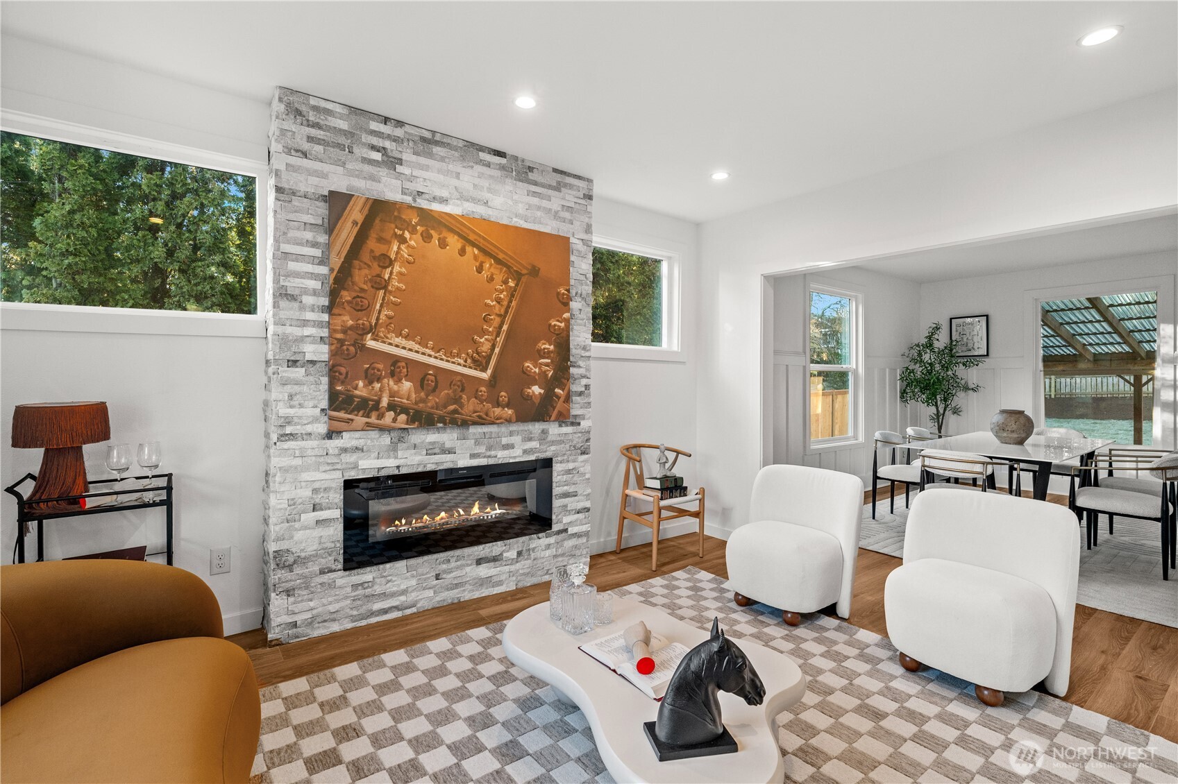 4706 Southwest Eddy Street Seattle, WA 98136 - Photo 6 of 27 a living room with furniture a fireplace a lamp and a large window