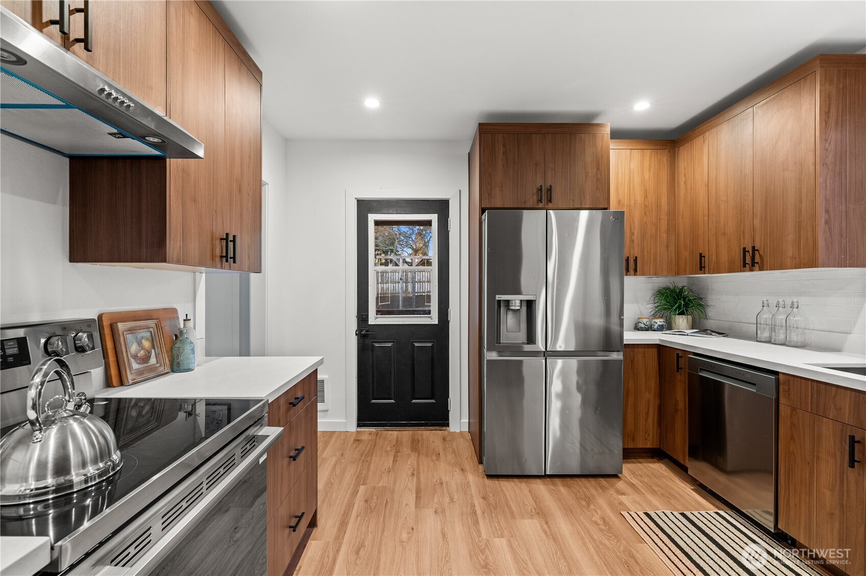 4706 Southwest Eddy Street Seattle, WA 98136 - Photo 10 of 27 a kitchen with granite countertop a refrigerator stove and sink