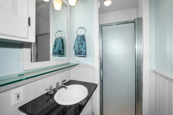 a bathroom with a sink and a mirror