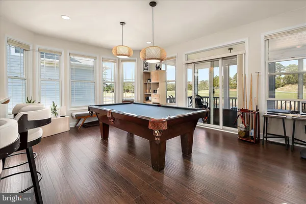 a kitchen with stainless steel appliances granite countertop a sink counter space cabinets and a large window