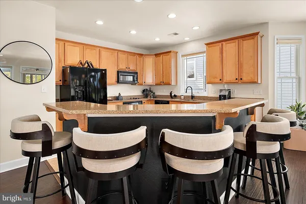 a living room with a fireplace and a floor to ceiling window