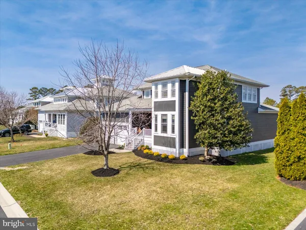 a view of a chair and table on the roof deck