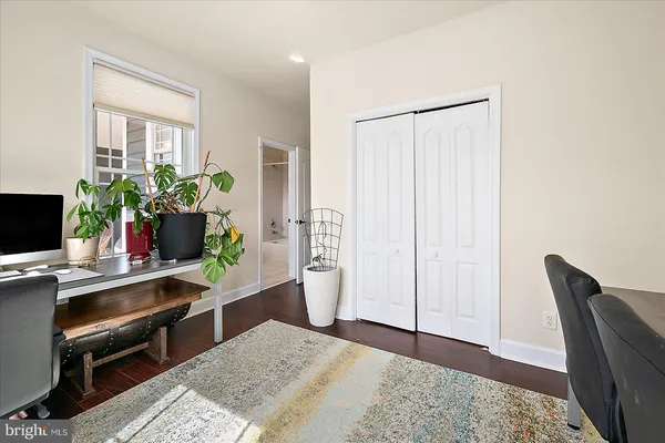 a spacious bathroom with a sink a large mirror and a shower