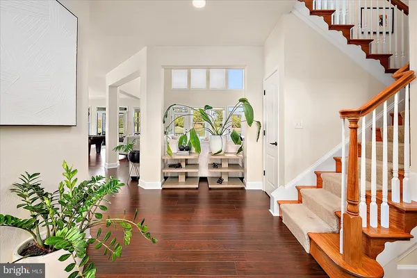 a bedroom with a bed and ceiling fan