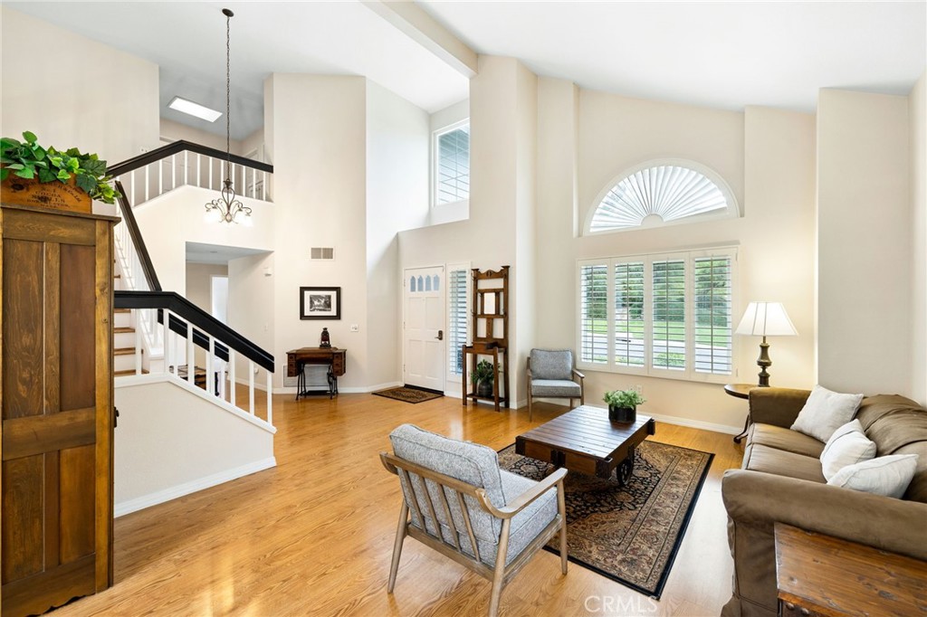 855 Ave Bernardo San Dimas, CA 91773 - Photo 12 of 65 Wide angle of the living room looking towards the staircase and front window.