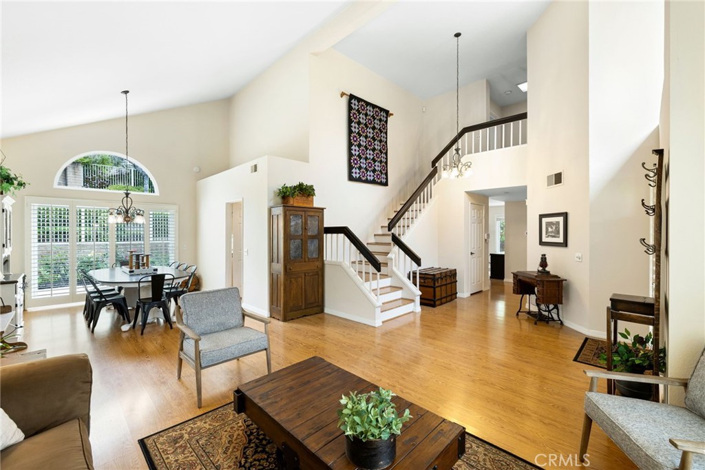 855 Ave Bernardo San Dimas, CA 91773 - Photo 14 of 65 a living room with couches chairs and kitchen view with wooden floor
