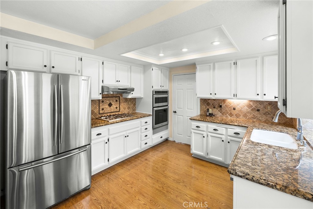 855 Ave Bernardo San Dimas, CA 91773 - Photo 19 of 65 a kitchen with granite countertop stainless steel appliances and refrigerator