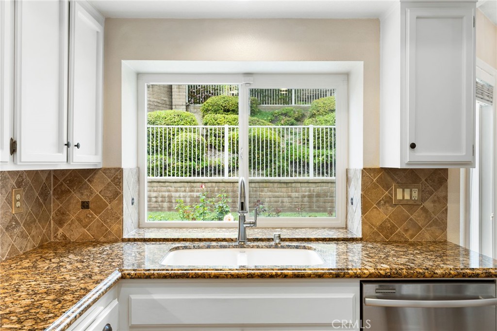 855 Ave Bernardo San Dimas, CA 91773 - Photo 23 of 65 a kitchen with granite countertop a window and a white counter top