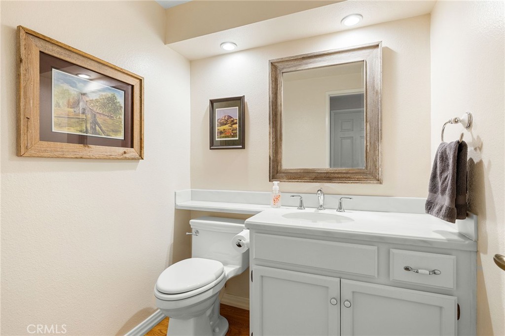 855 Ave Bernardo San Dimas, CA 91773 - Photo 30 of 65 a bathroom with a toilet sink and mirror