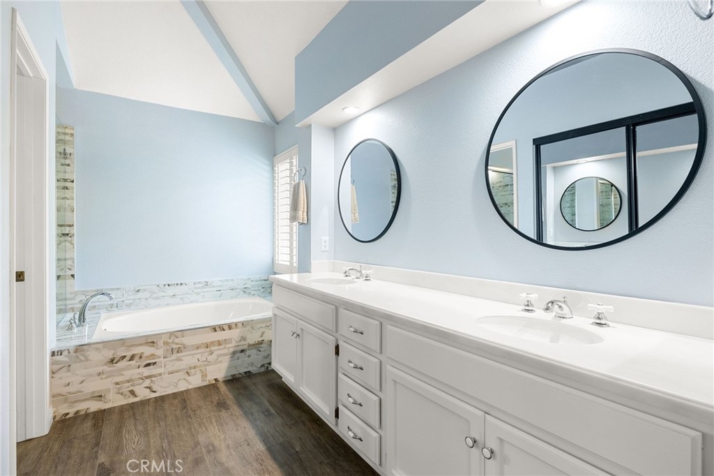 855 Ave Bernardo San Dimas, CA 91773 - Photo 36 of 65 a bathroom with a double vanity sink and a mirror