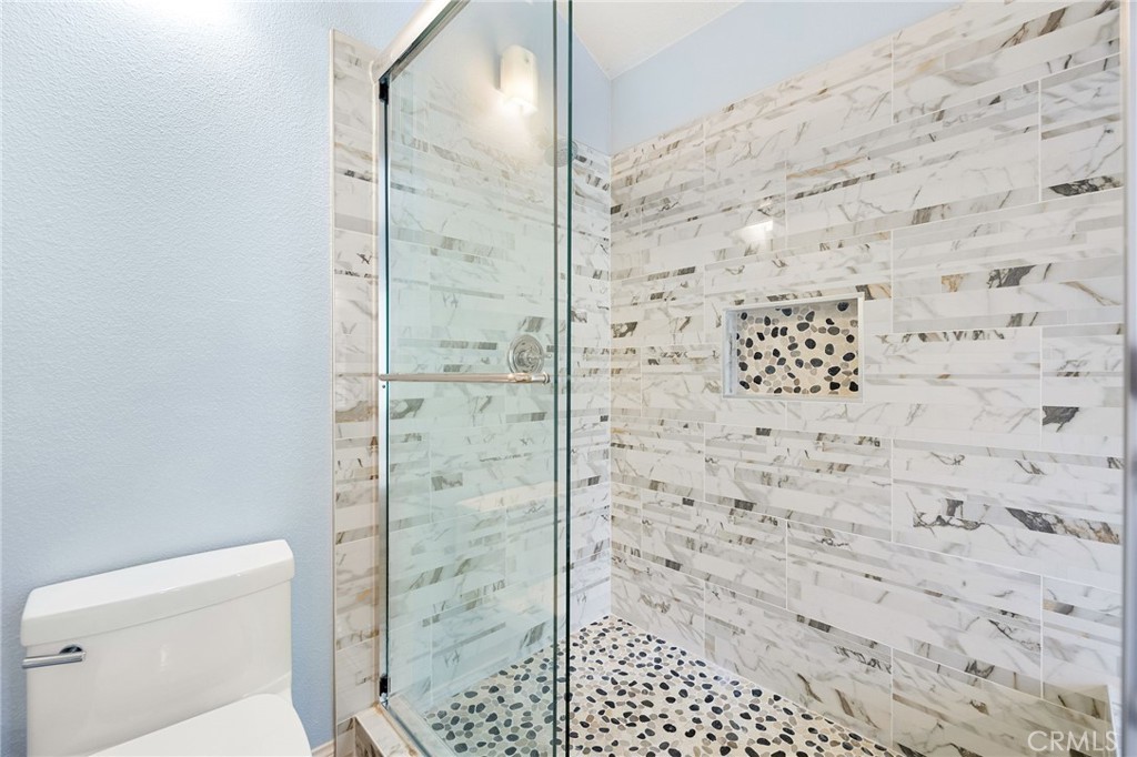 855 Ave Bernardo San Dimas, CA 91773 - Photo 40 of 65 a bathroom with a shower and a toilet